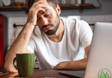 man drinking coffee exhausted
