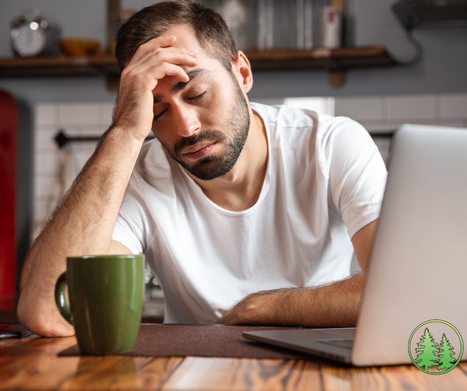 man drinking coffee exhausted